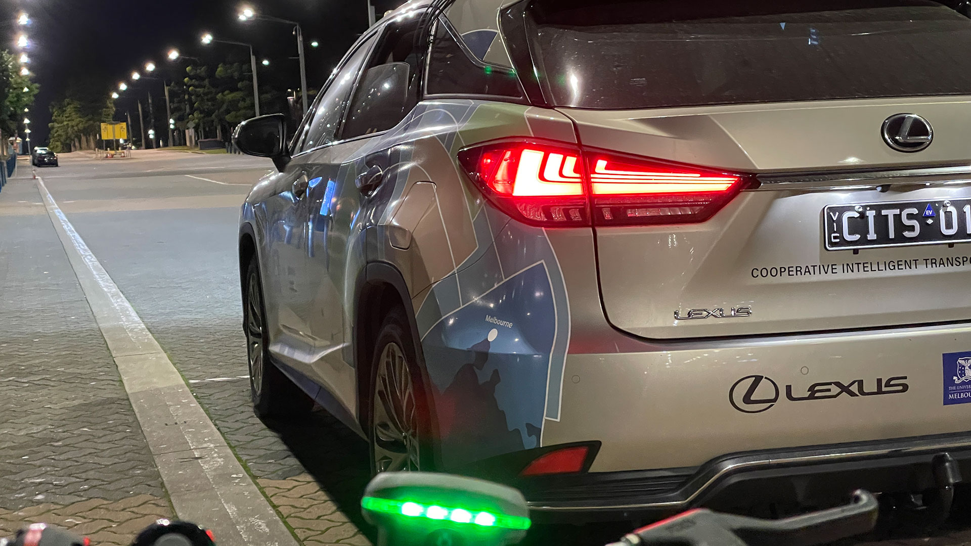 Lexus vehicle and bicycle both fitted with C-ITS technology during trials. All images indicative only